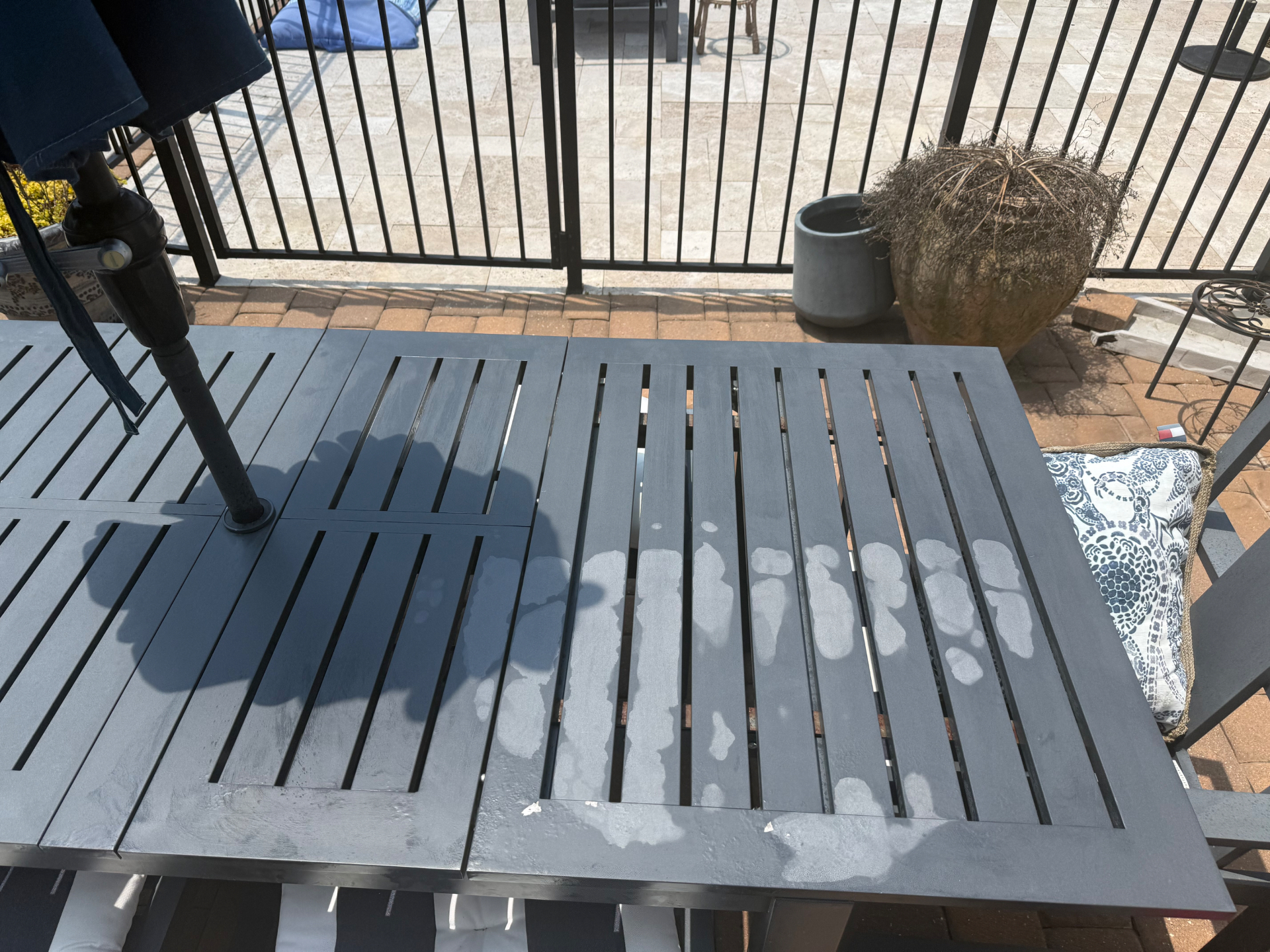 Outdoor table being refinished with a fresh coat of exterior paint